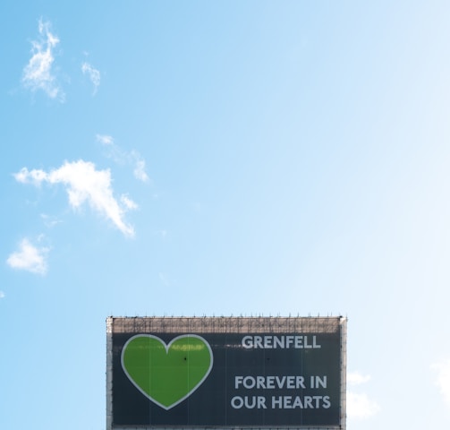 white and black signage under blue sky during daytime