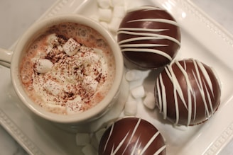 A cozy cup of gourmet hot chocolate topped with whipped cream.