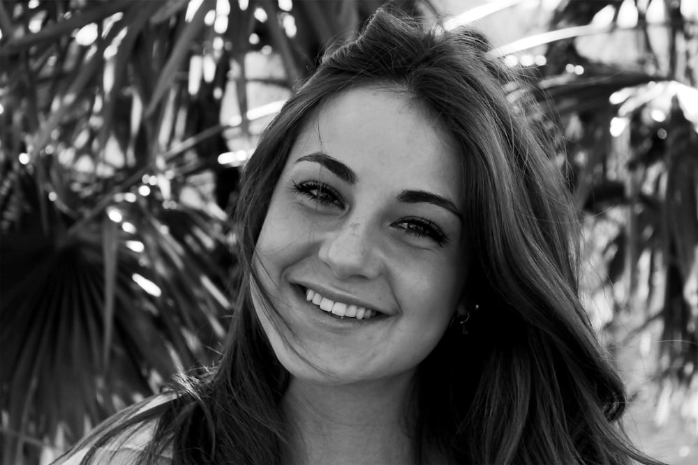 grayscale photo of smiling woman