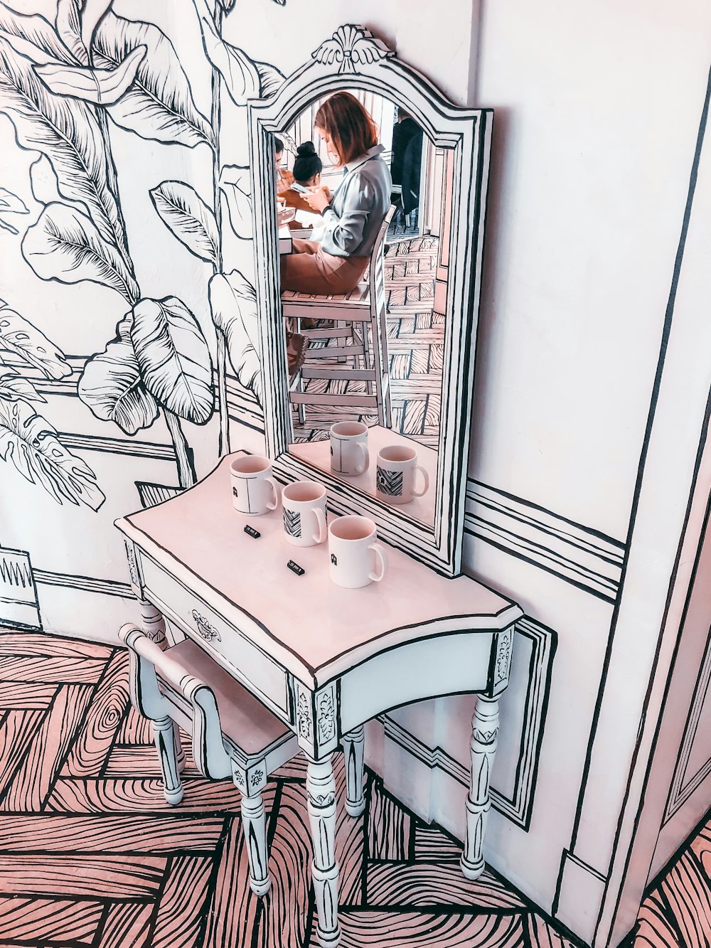 white wooden table with 2 chairs