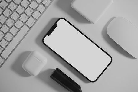 white apple keyboard on white table, who do I call for help