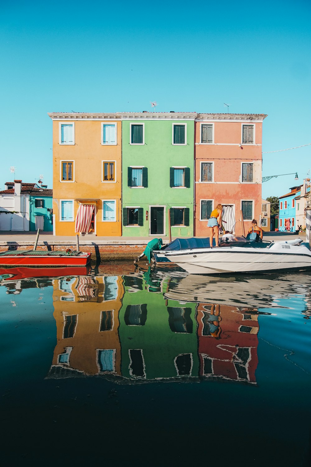 boat on water near building during daytime