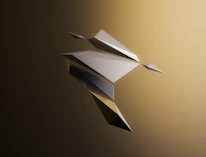 Abstract gold and black geometric shapes symbolizing growth and precision against a dark background.