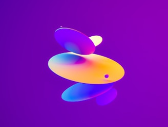 A series of colorful, rounded, overlapping geometric shapes float against a vibrant purple background. The shapes exhibit a gradient of colors, including shades of orange, yellow, blue, and pink.