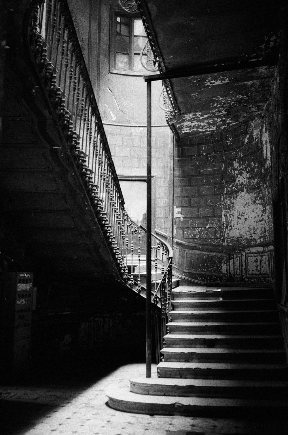 grayscale photo of staircase in tunnel