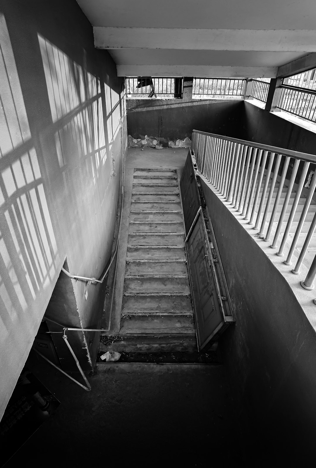 grayscale photo of concrete staircase