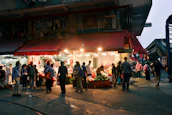 A vibrant marketplace scene showing small business owners interacting with customers.