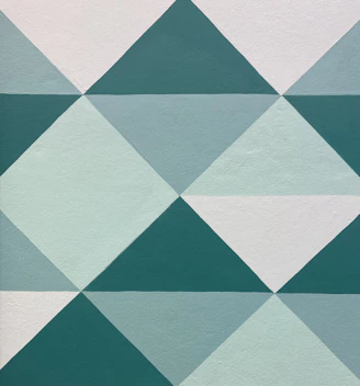 A vibrant geometric design blending teal and blue shapes symbolizing growth and unity.