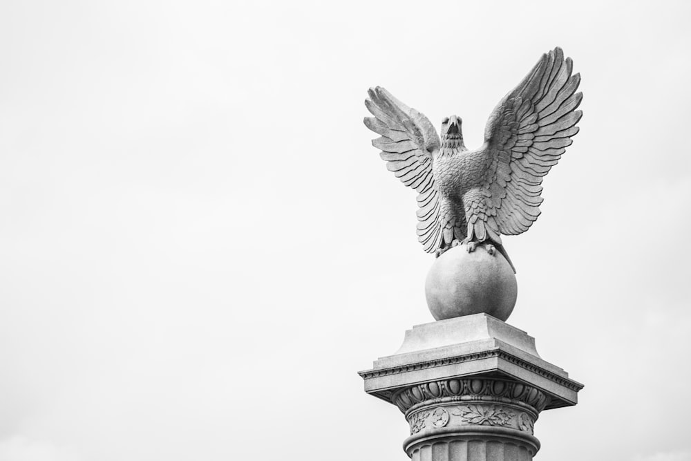 angel statue under white sky during daytime