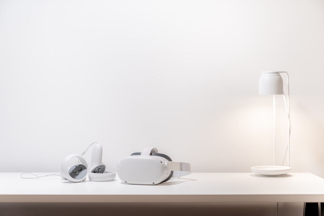 white ceramic teacup on saucer on table, oculus quest 2 on white desk with lamp