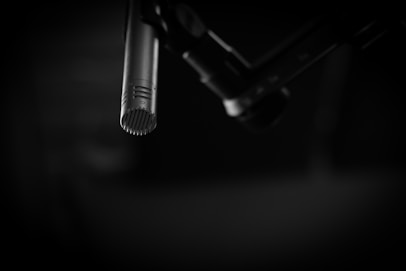 black and gray microphone on black background