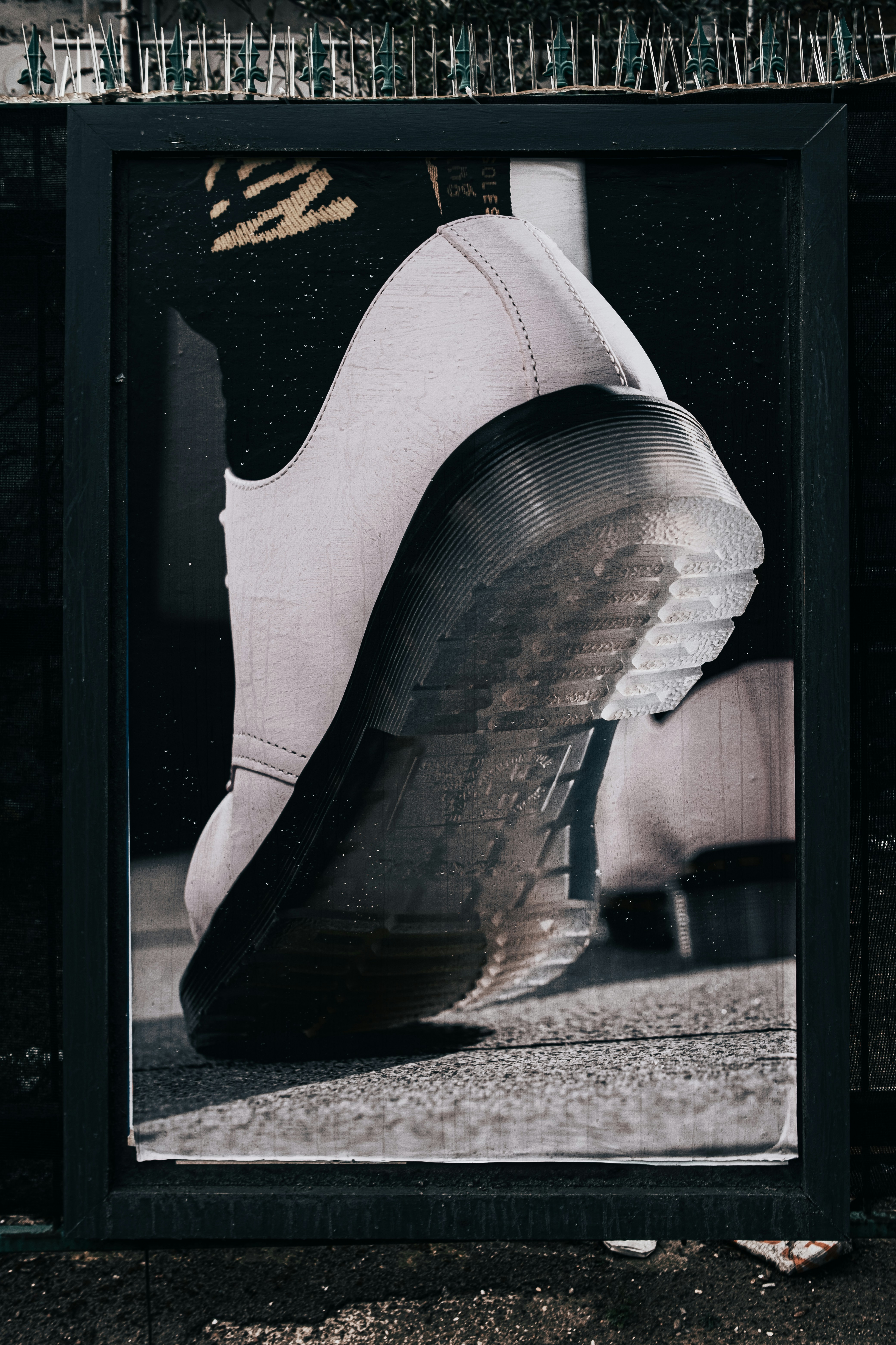person wearing black and white nike athletic shoes