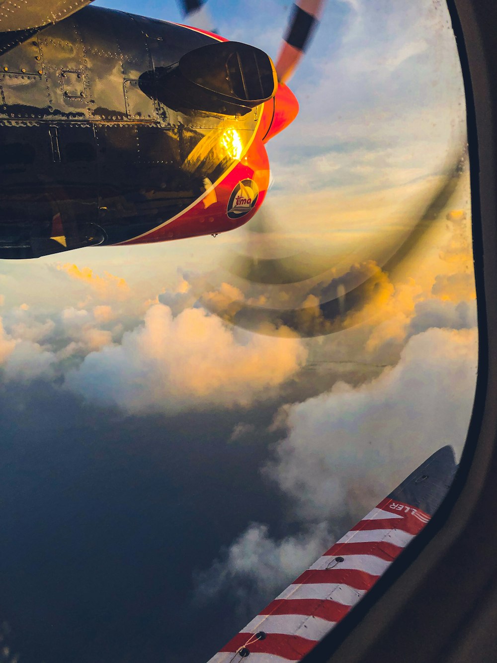 red and white plane on sky