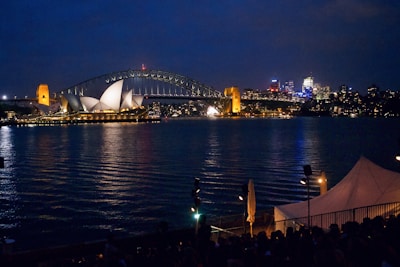 Night view of Kobe Harborland with reflections of city lights shimmering on the water.