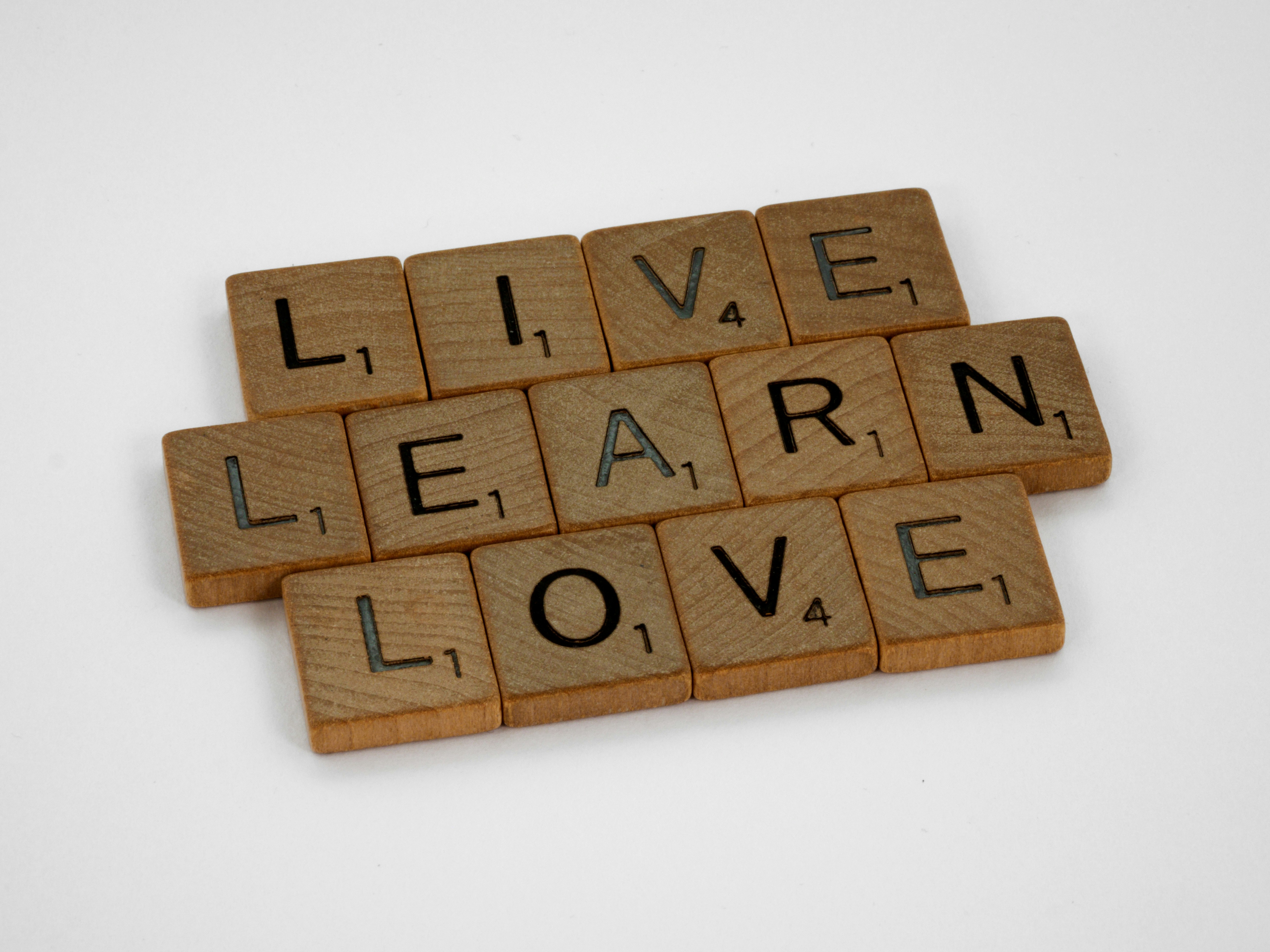 scrabble, scrabble pieces, lettering, letters, wood, scrabble tiles, white background, words, quote, letters, type, typography, design, layout, focus, bokeh, blur, photography, images, image, live, learn, love, life, live life, live learn love, keep learning, stay open, holistic, mindfulness, loving, learning, living, 