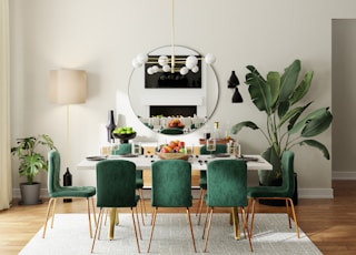 green and white wooden dining table and chairs