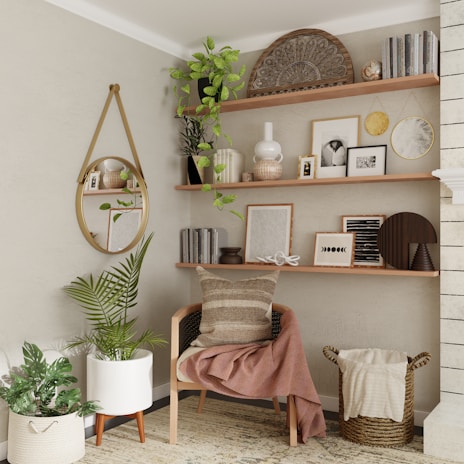 A cozy living room corner featuring a stylish woven basket for blankets and a sleek wall-mounted shelf with neatly arranged books and plants.