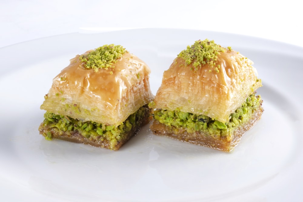 two brown bread on white ceramic plate