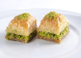 two brown bread on white ceramic plate