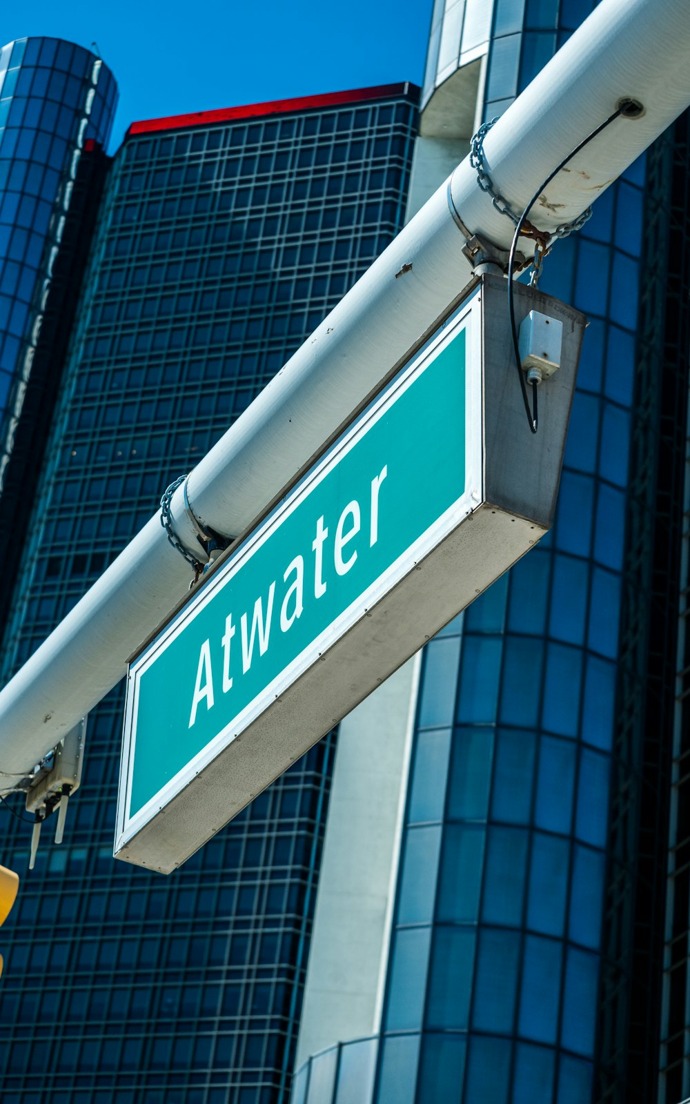 a close up of a street sign with a building in the background