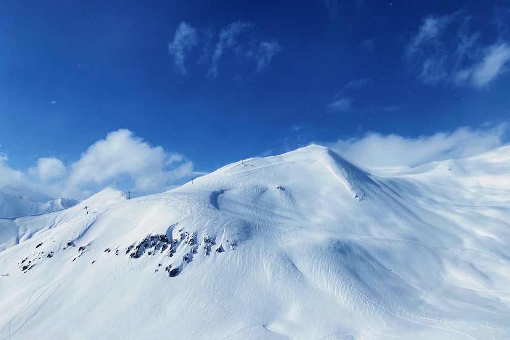 white snow covered mountain under blue sky during daytime