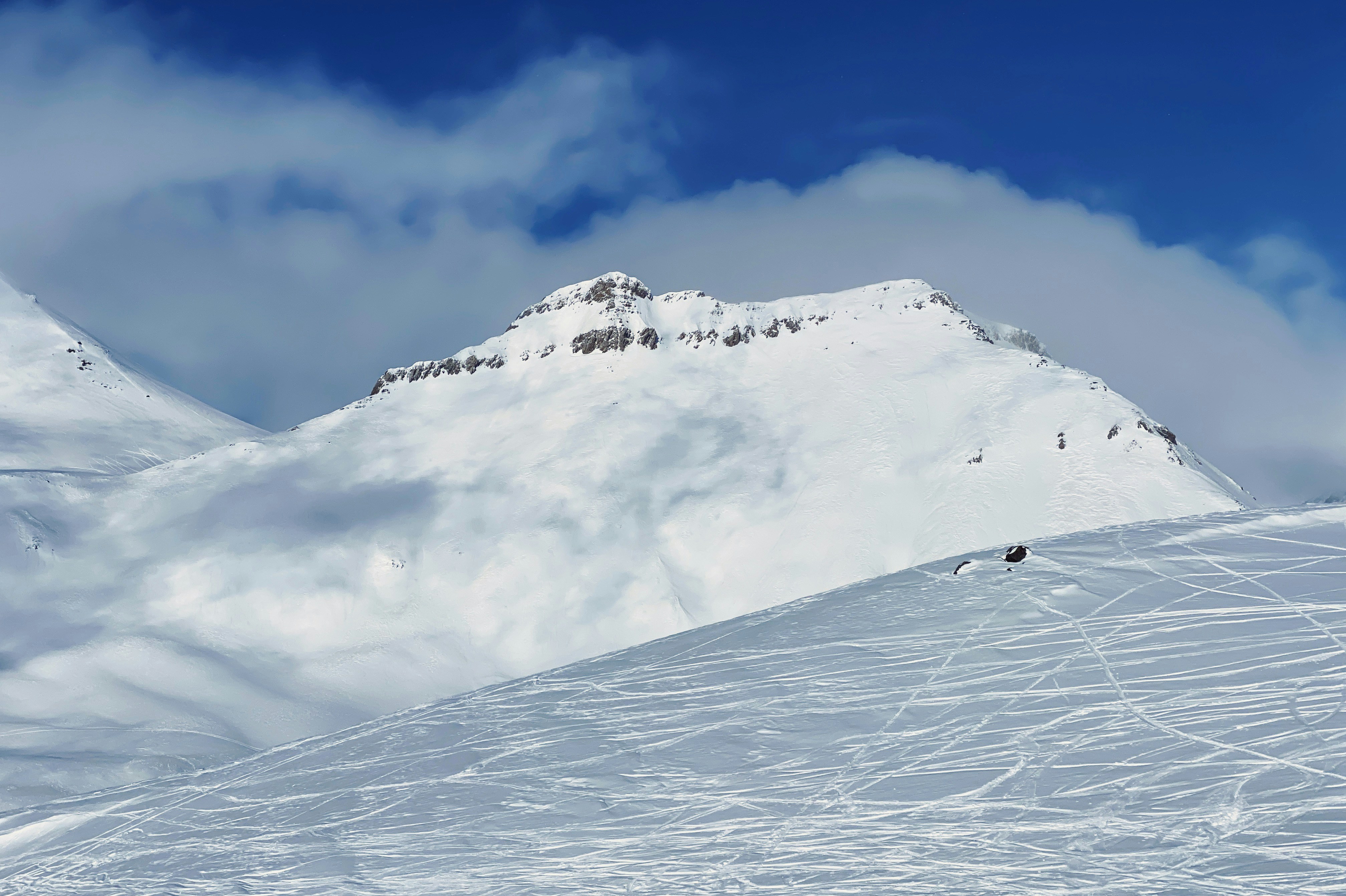 snow covered mountain under blue sky during daytime