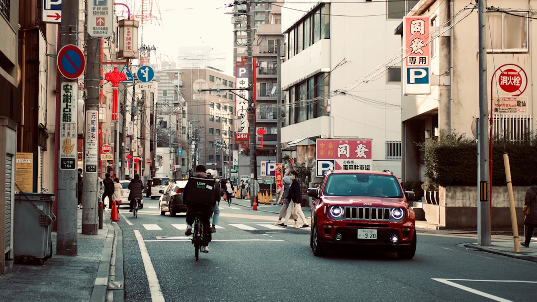 red and white mini cooper on road during daytime