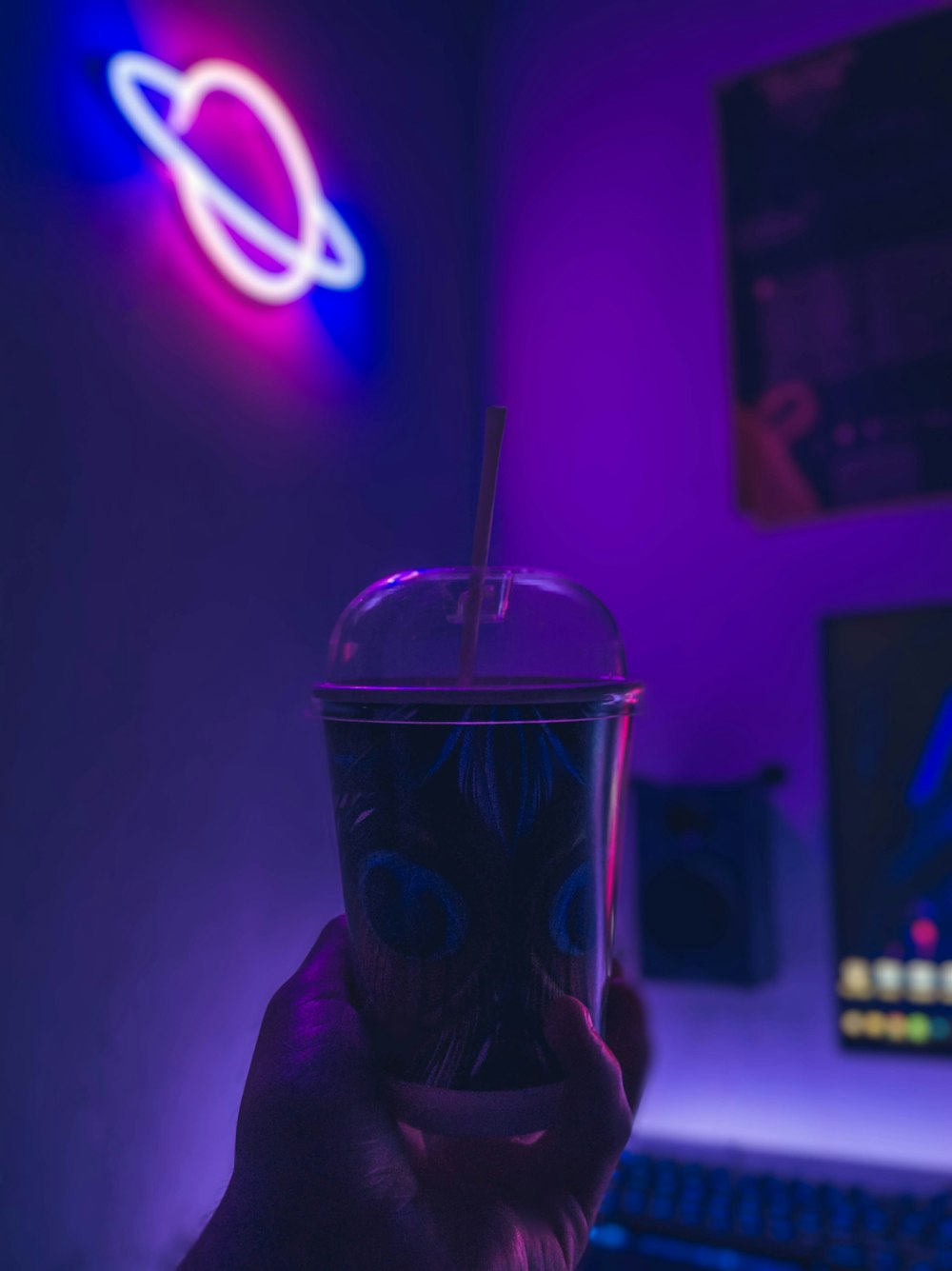 person holding black and white disposable cup