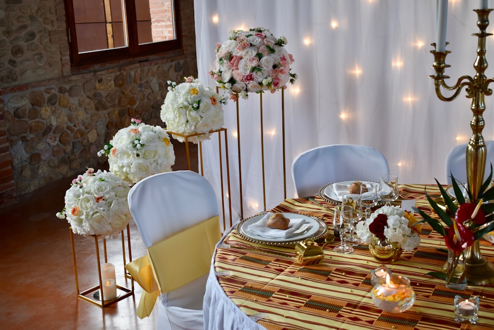 white and pink flowers on table