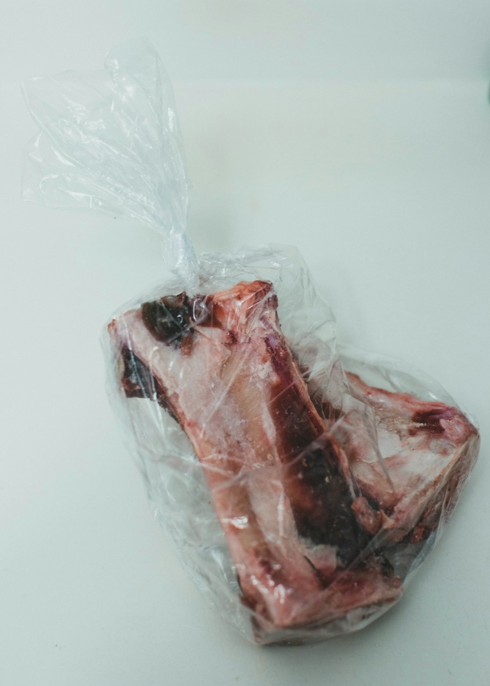 red meat in white plastic bag