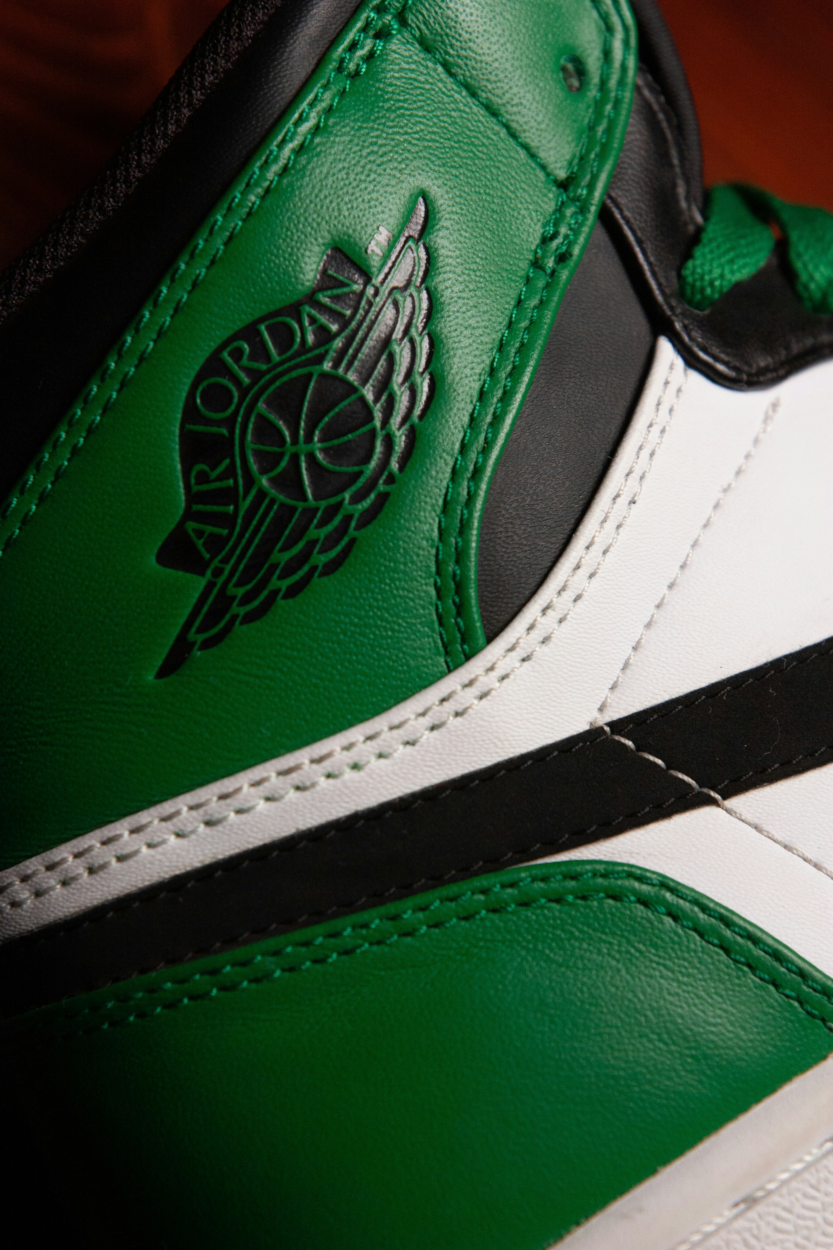 Green and white nike shoe