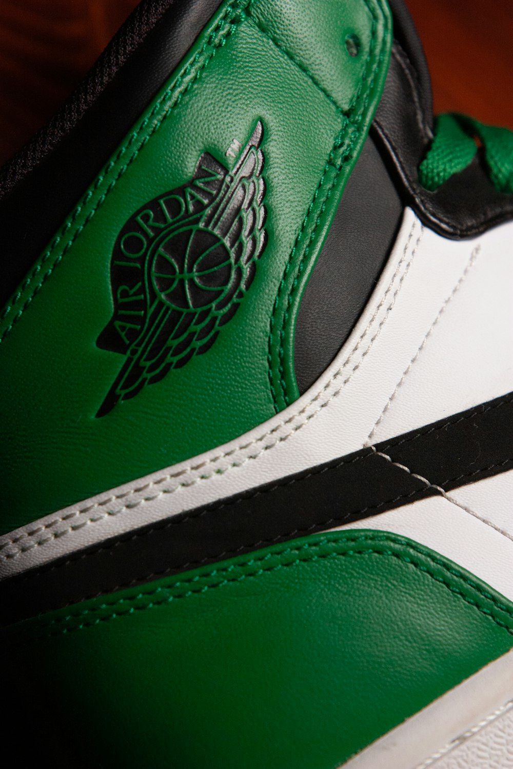 green and white nike shoe