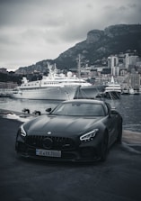 black porsche 911 parked on dock during daytime