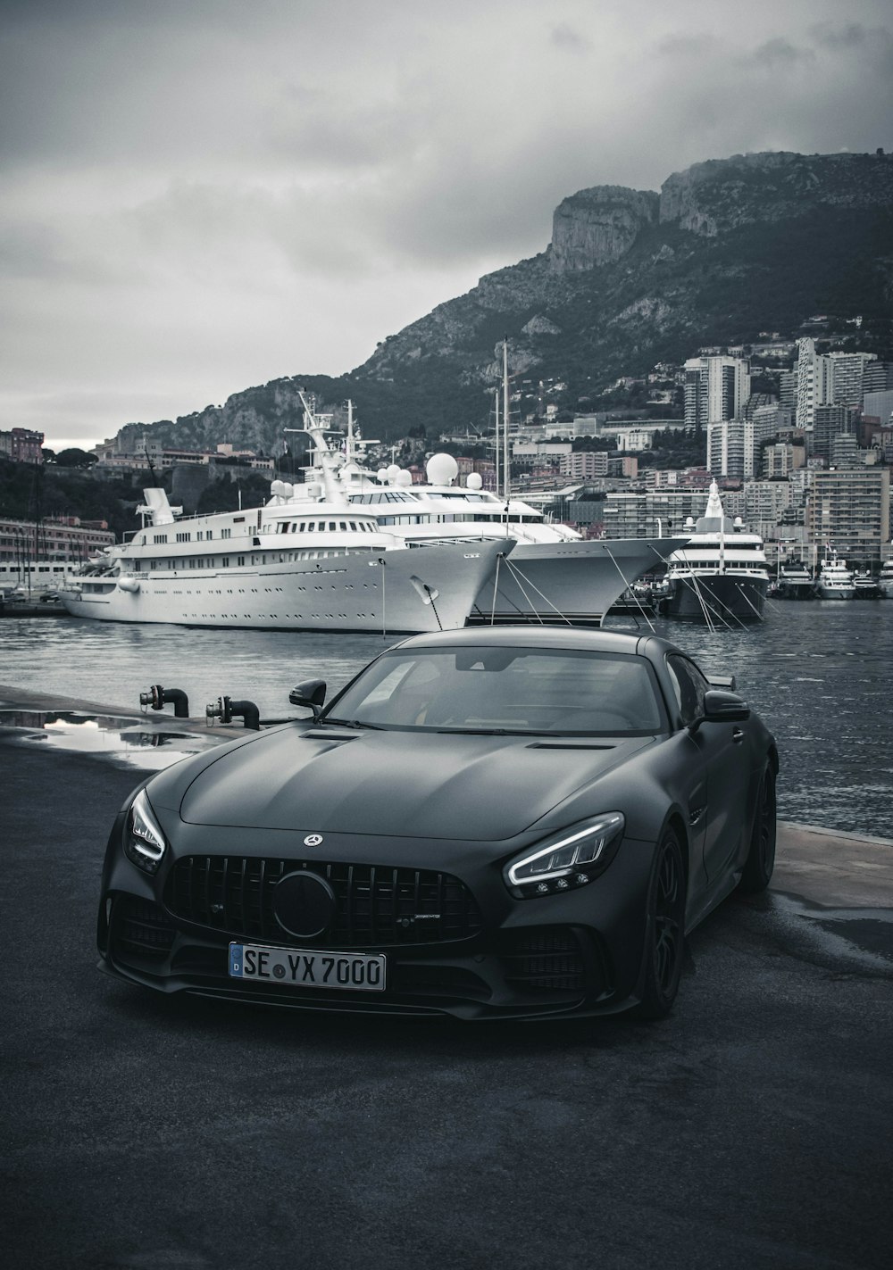 black porsche 911 parked on dock during daytime