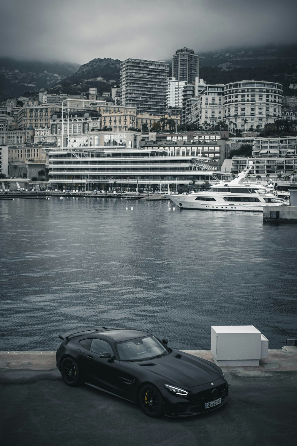 white and black yacht on body of water during daytime