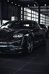 A sleek, modern car displayed in a well-lit showroom.