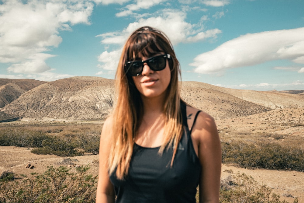 woman in black tank top wearing black sunglasses