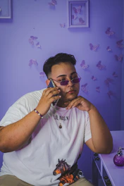 A confident Purplerose sales agent making an outbound call with a headset in a sleek, modern office.