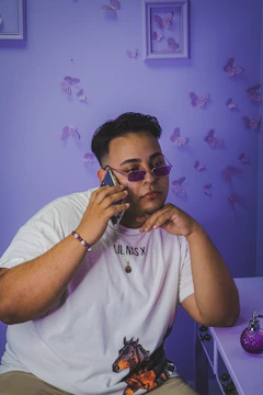 A confident Purplerose sales agent making an outbound call with a headset in a sleek, modern office.