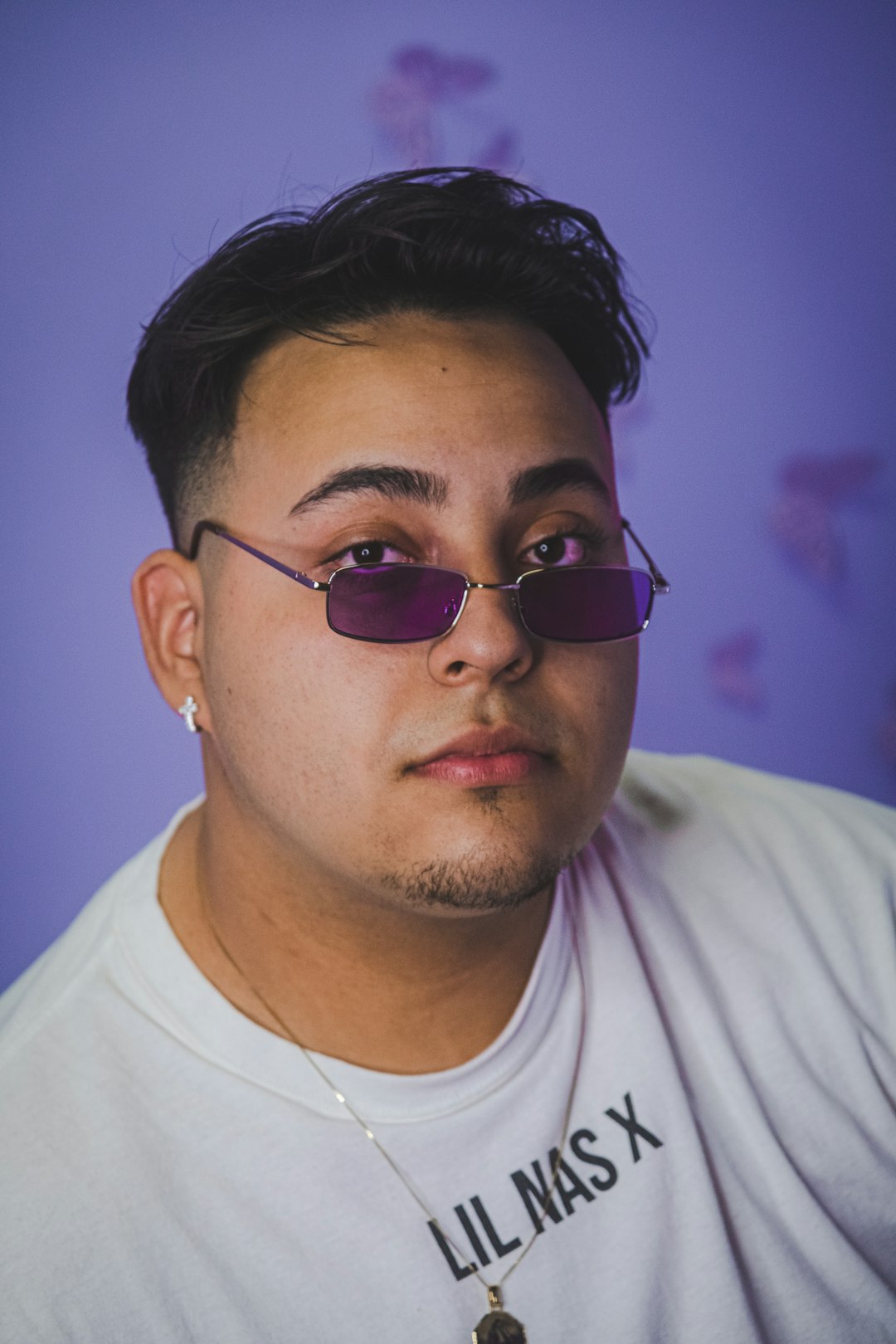 man in white crew neck shirt wearing black sunglasses