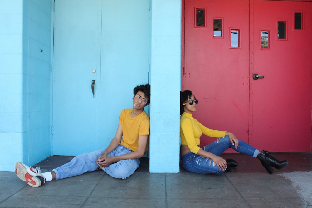 man in yellow polo shirt sitting beside woman in yellow shirt