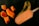 Several pieces of ripe orange mango are arranged alongside a melting mango popsicle on a dark surface. The popsicle features a visible splash of green and orange liquid, suggesting freshness and indulgence.