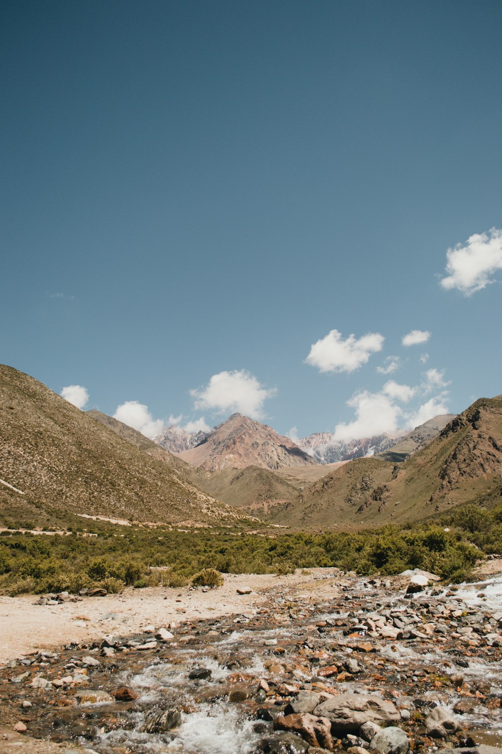 brown and green mountains under blue sky during daytime