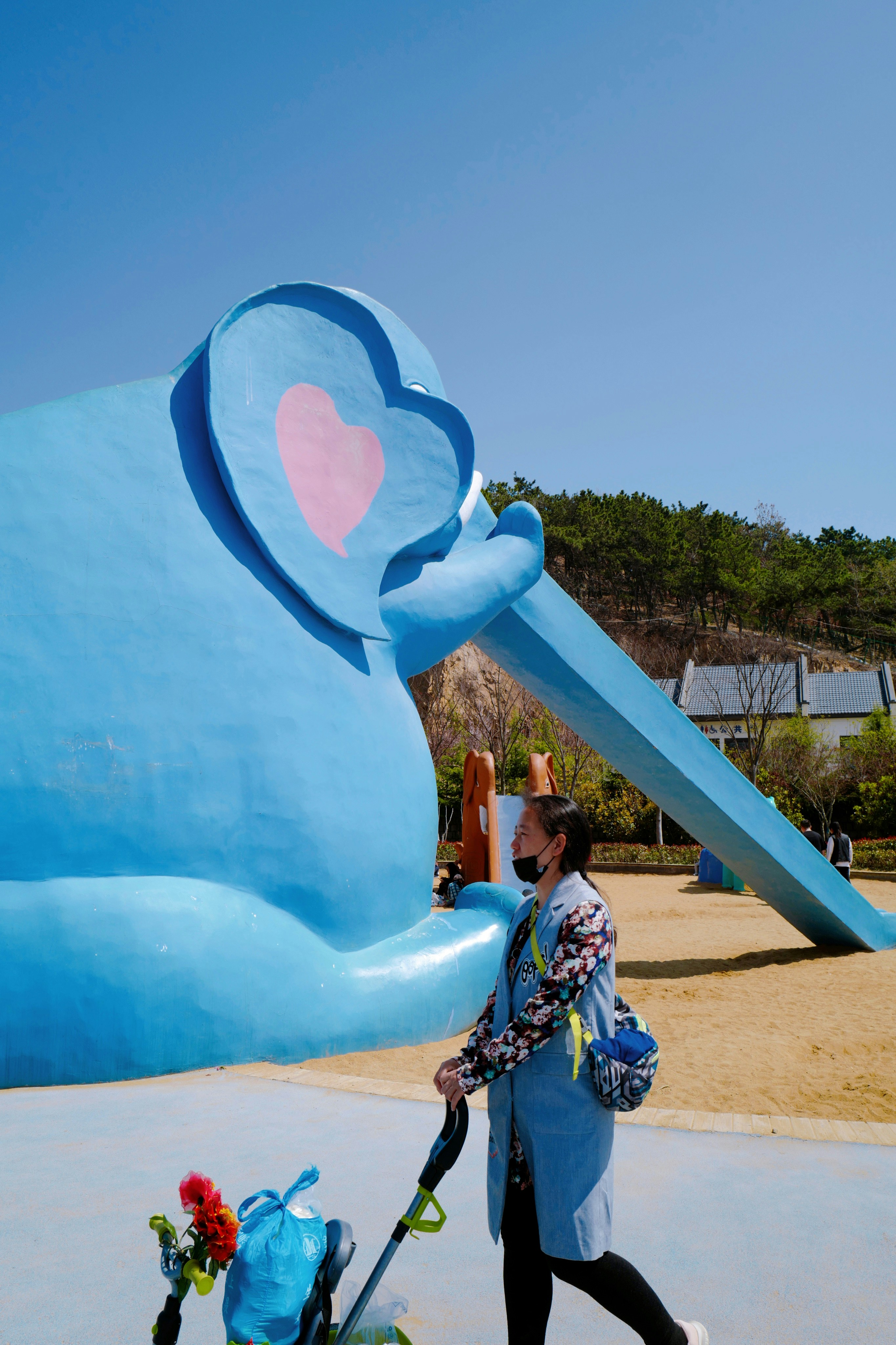 Man in blue and white plaid shirt sitting on blue inflatable inflatable ...