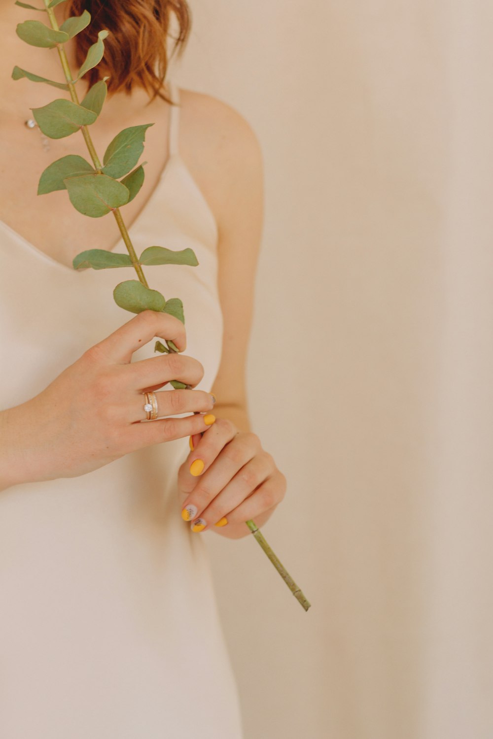 woman holding green flower with white background