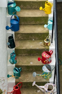 blue plastic bucket on gray concrete stairs