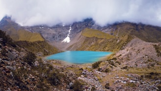 lake in the middle of mountains