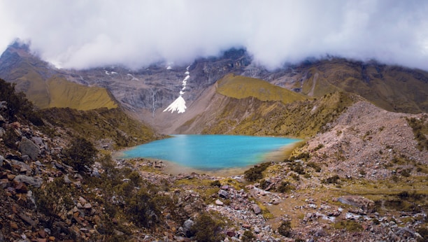 lake in the middle of mountains