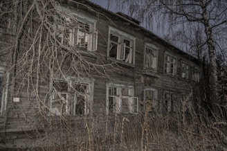 A haunting image of an old, abandoned building representing forgotten crime scenes.