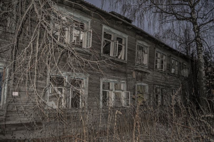 A haunting image of an old, abandoned building representing forgotten crime scenes.